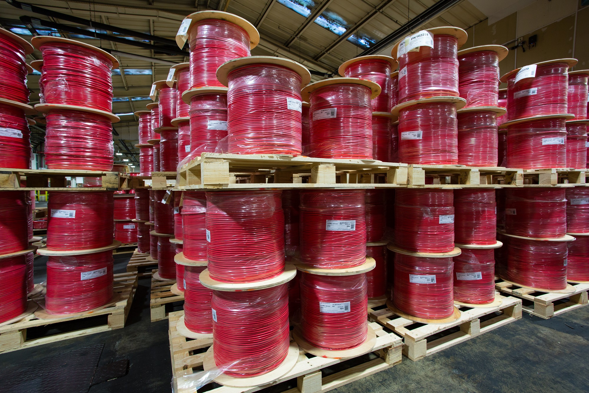 Red FP drums stored in a warehouse