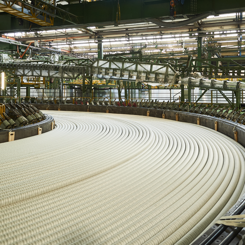 White large subsea cables on a large cable drum