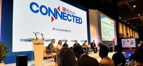 An image of five people taking part in a panel discussion at the Connected Britain 2024 event.